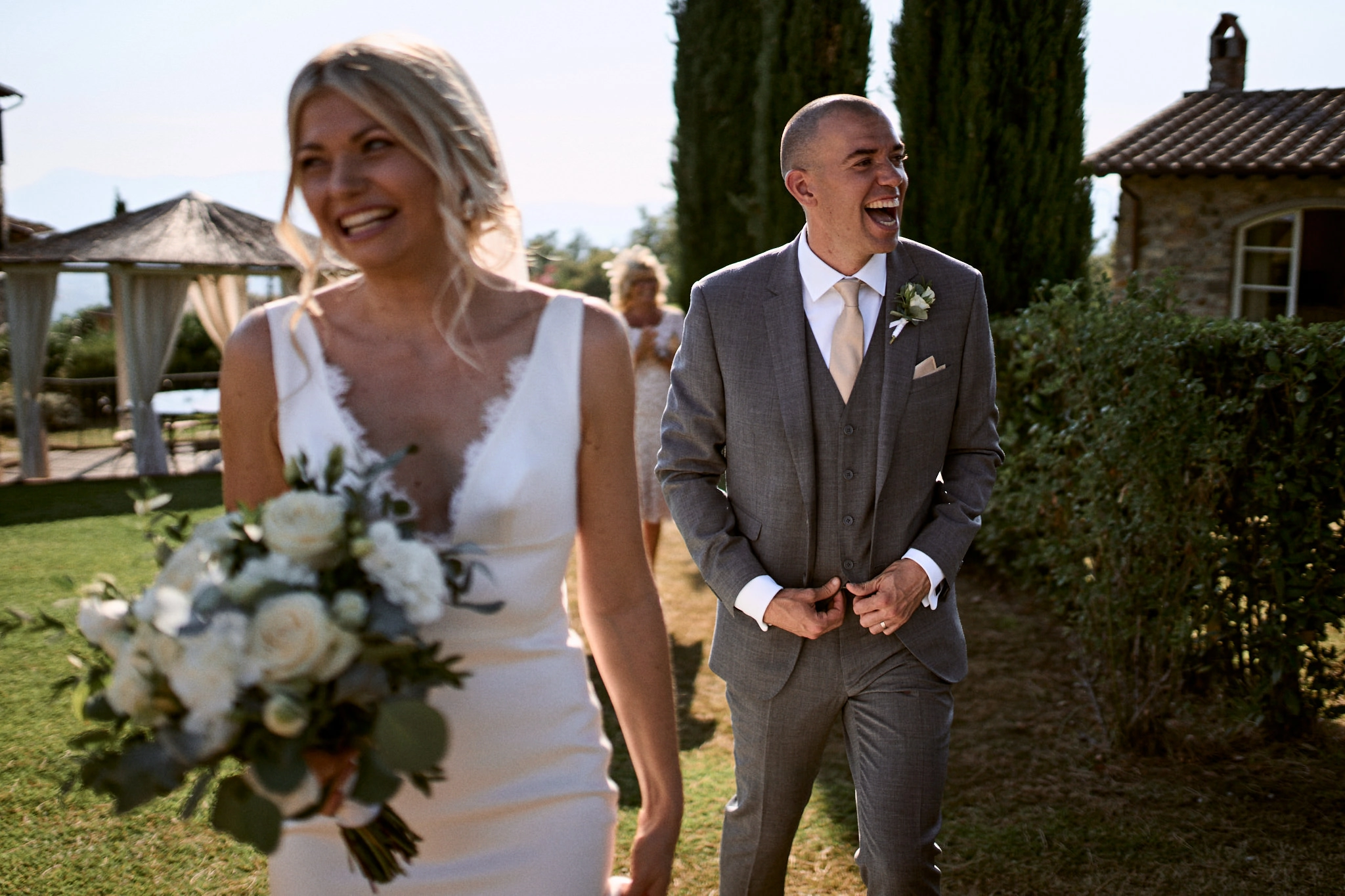 capturing love europe destination weddings Wedding couple smiling and looking at different direction with Tuscany backdrop